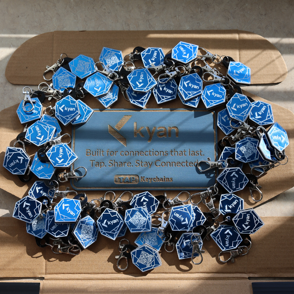 Bulk custom blue metallic NFC keychains with crystal logo design and tap-to-share technology