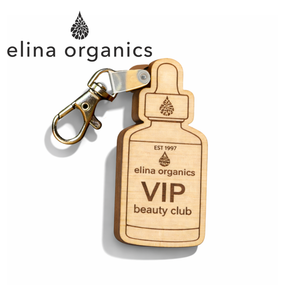 Custom wooden NFC keychain shaped like a beauty bottle with Elina Organics VIP Beauty Club engraving