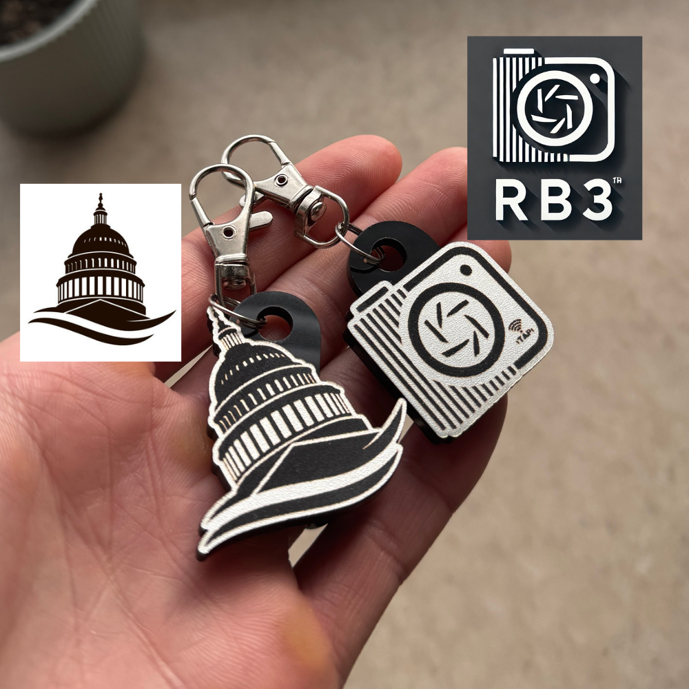 Silver Custom Logo NFC Keychains hand holding two examples