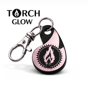 Custom NFC Keychain shaped like a flame in rose gold with black engraving