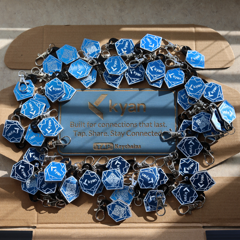 Bulk custom blue metallic NFC keychains with crystal logo design and tap-to-share technology