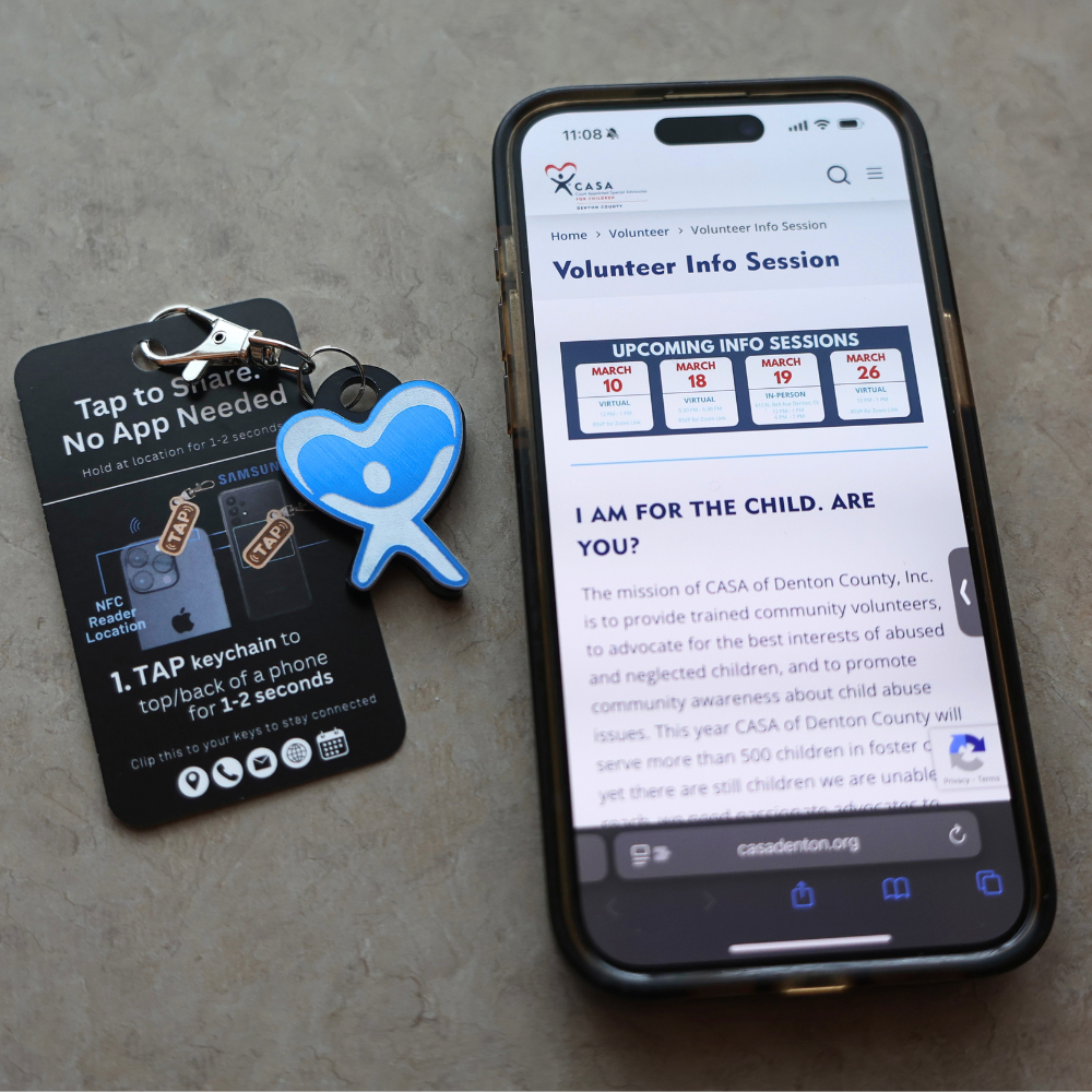 NFC Keychain next to phone with opened website